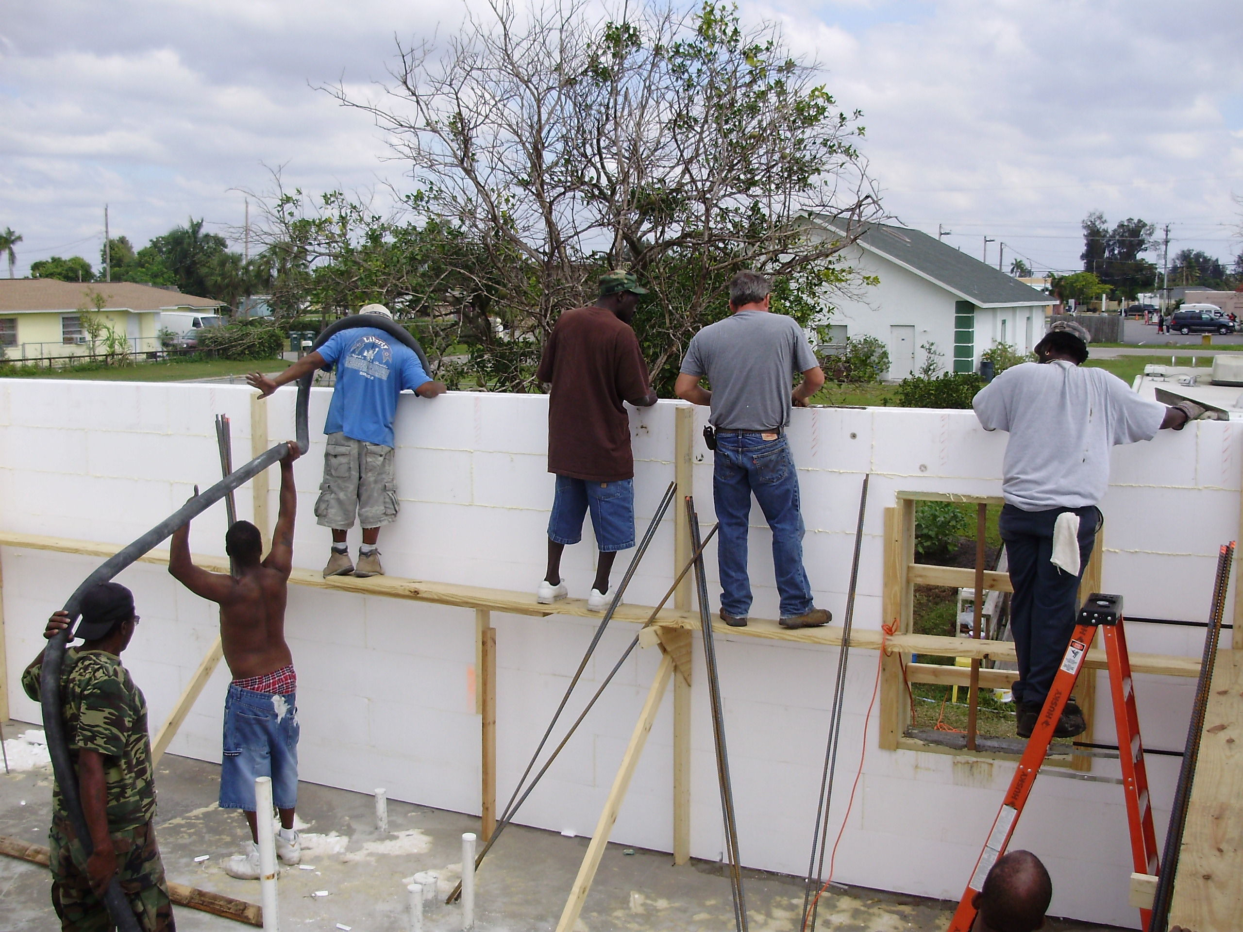 Local community helping with concrete placement